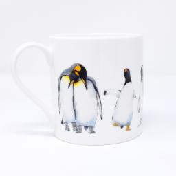 A quite big mug with a penguin design - handle facing left