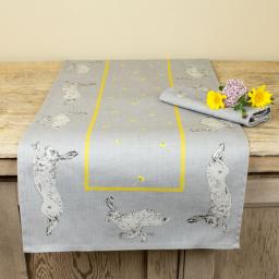 Table runner with hare and dandelion design