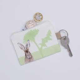 A key fob purse with a hare design