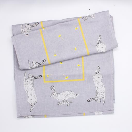 Table runner with hare and dandelion design - folded